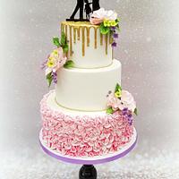Pink wedding cake with ruffels