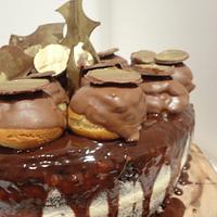 Naked cake with chocolate glaze and profiterole