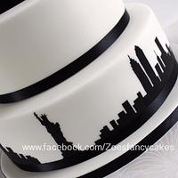 Hand painted New York skyline wedding cake