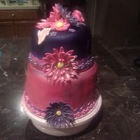 pink and purple cake with gerber daisy