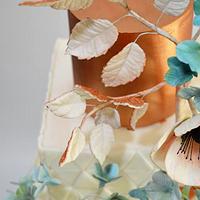 White and copper wedding cake