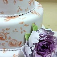 Lilac and rose gold wedding cake with peonies