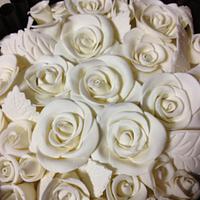 Decorating with dark chocolate cigarillos and white chocolate roses