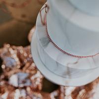 Marble wedding cake with blush and copper 