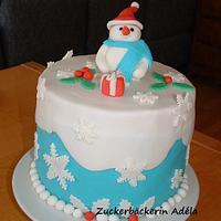 Snowman on a extra high cake