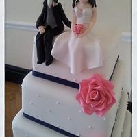 Bride & Groom topped wedding cake 