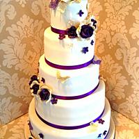 Ivory & purple 5 tier wedding cake