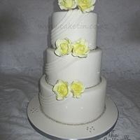 Yellow Roses and Fabric Drapes Wedding cake