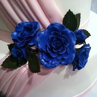 pink swag with blue sugar roses