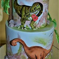 Hand painting dinosaurs cake