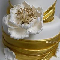Wrapped gold painted Wedding cake