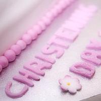 Pretty pink christening cake