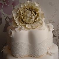Vintage lace and blossoms wedding cake