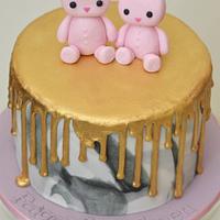Bunnies on a gold drip marbled cake