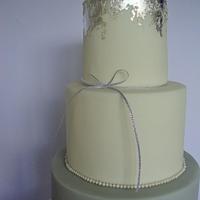 Grey, ruffle and silver leaf wedding cake.