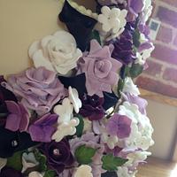 Beautiful purple flower cascade wedding cake