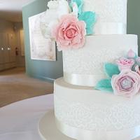 Ivory tiers with pastel blooms...