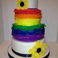 Rainbow frilled wedding cake with fantasy poppies