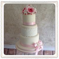 Pink and Ivory vintage lace 3 tier wedding cake with berries and roses.