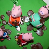 Peppa Pig and family splashing in muddle puddles
