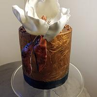 Birthday cake with magnolia flower
