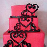 hot pink with black hearts wedding cake
