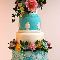 Turquoise wedding cake with flowers
