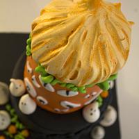 halloween cake with meringue pumpkin topper