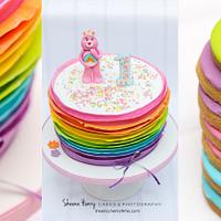 Rainbow ruffled care bear cake 