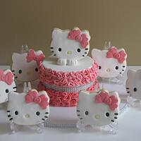 A ruffle Hello kitty cake with sugar cookies 