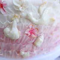 delicate lace and flower baptism cake