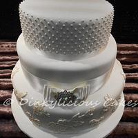 Ivory vintage inspired wedding cake.