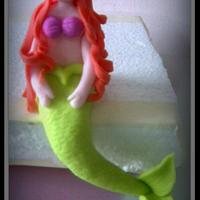 Mermaid-themed cake topper