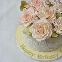 Pale yellow cake with sugar roses 