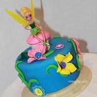 Tinkerbell and her fairy friends on a cool cakestand in the garden :)
