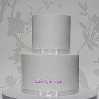 Simple, elegant white wedding cake