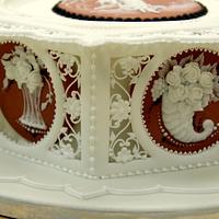 Royal icing panelled cake with pressure piping