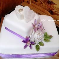 wedding cake with purple orchid 