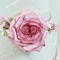 Dusky pink wedding cake with heart roses