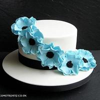 Ivory Cake with Blue Casual Roses