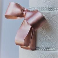 rose gold bow and white ruffles