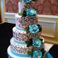 Black scrolling wedding cake