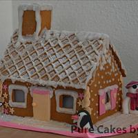 Penguins with their Gingerbread House
