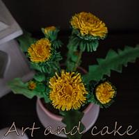 Dandelion made of gum paste and the pot of fondant...