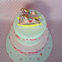 Girls rocking horse christening cake