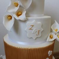 Gold wedding cake with Calla lilies