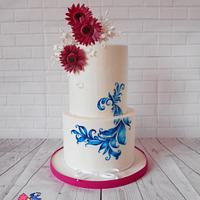 Wedding cake with gerberas and painted ornament