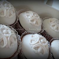 Romantic wedding cake with cupcakes