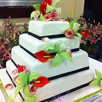 Roses, calla lilies and orchids wedding cake