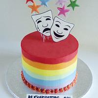 Buttercream rainbow stripe theatre masks cake